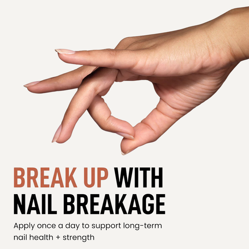 Hand with a focus on nail care, nail strength and health.